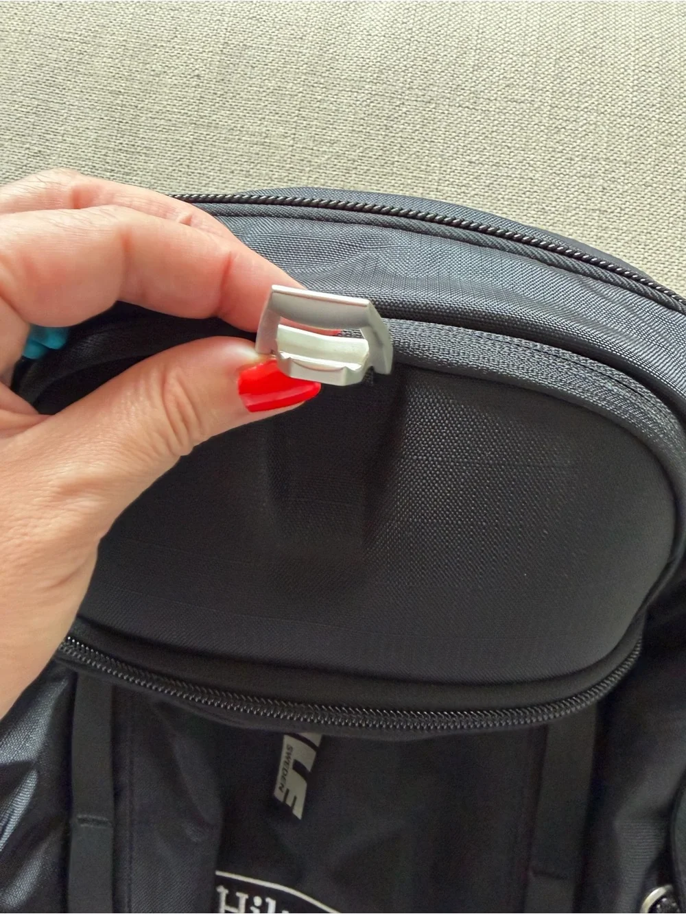 Thule Black Backpack with Aqua Zipper Pulls - Hilton Logo